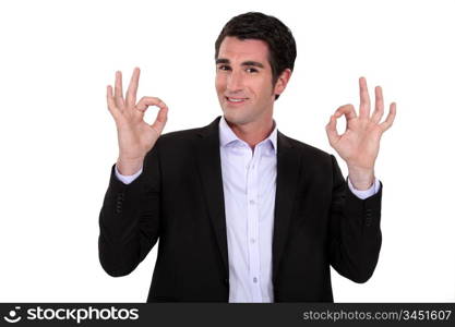 businessman smiling and doing the okay sign