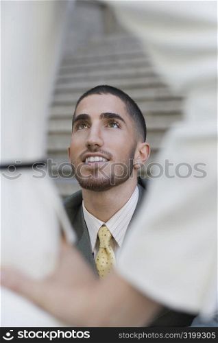 Businessman smiling and looking up