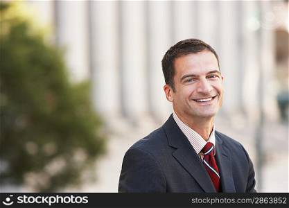 Businessman smiling outdoors portrait