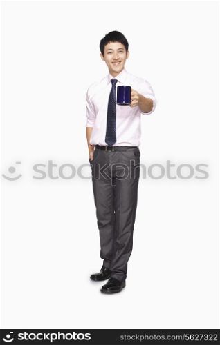 Businessman smiling with mug