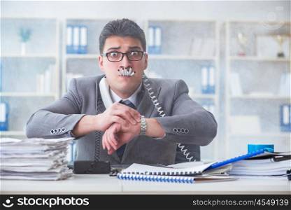 Businessman smoking in office at work
