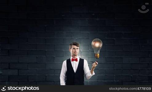 Businessman smoking pipe. Handsome young businessman thinking over ideas and smoking pipe