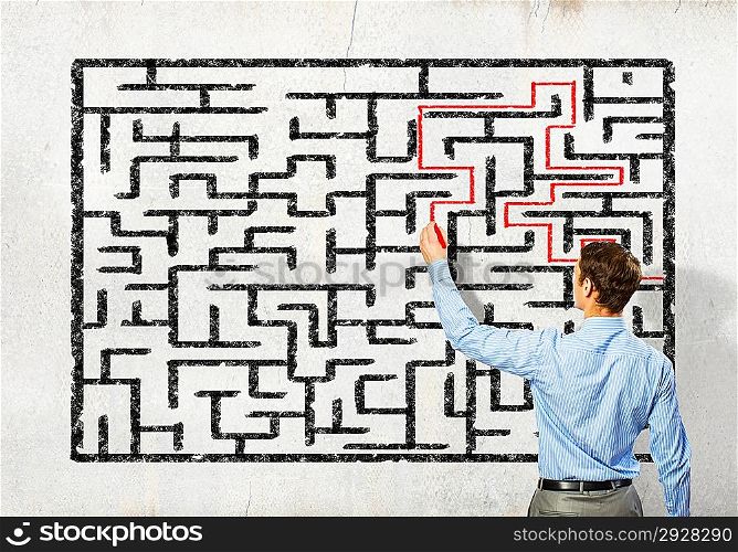 Businessman solving labyrinth problem