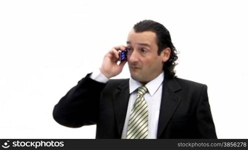 businessman speaks with irritation by phone.