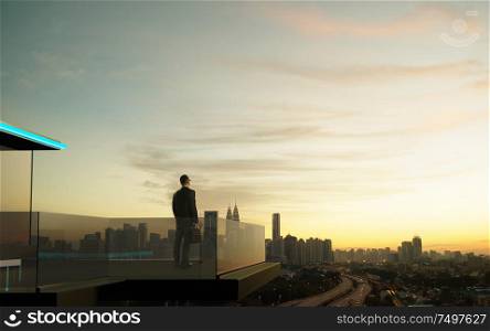 Businessman stand at open balcony looking great cityscape view and thinking business plan of the future .