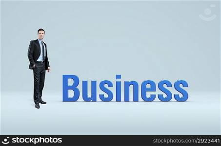 Businessman stand near word business. Idea concept.