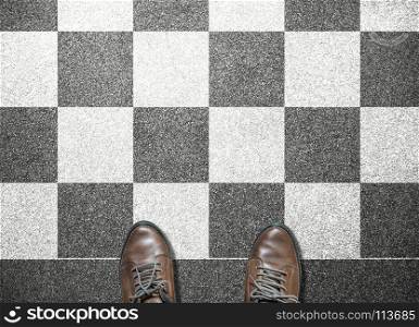 businessman stand on chess tile floor