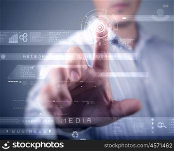 Businessman standing and working wth touch screen technology