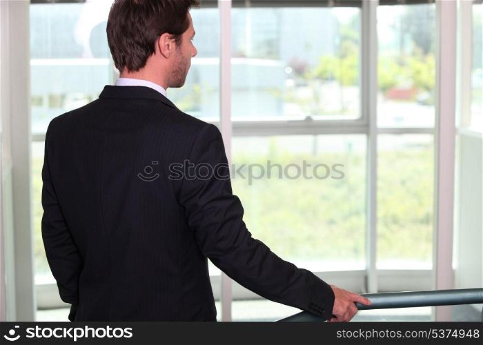 Businessman standing in a hall