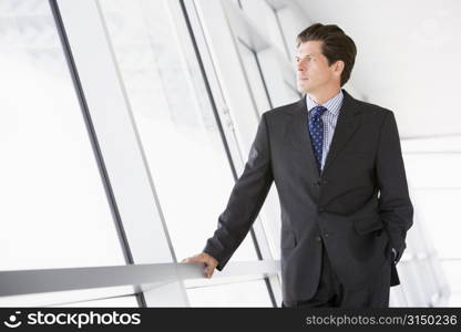 Businessman standing in corridor