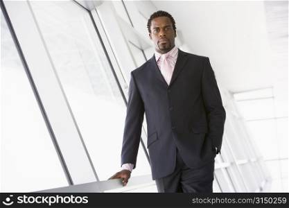 Businessman standing in corridor