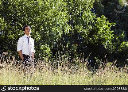businessman standing in field