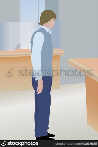 Businessman standing in front of a desk in an office
