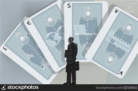 Businessman standing in front of cards with currency symbols