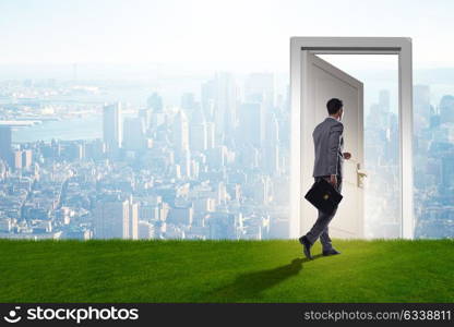 Businessman standing in front of door into future