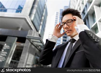 Businessman standing in street and trying to concentrate. I need to concentrate