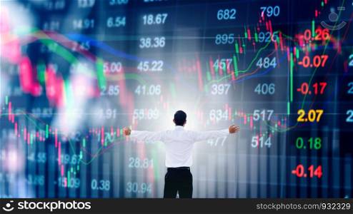 Businessman standing keeping arms raised and Businessman looking to stock market graph Success concept