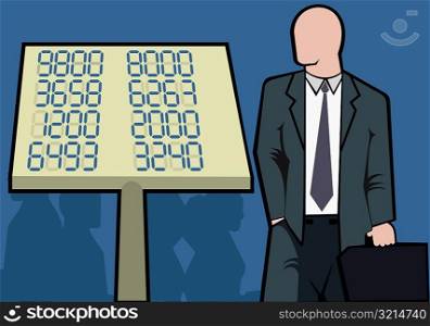 Businessman standing near a sign with numbers