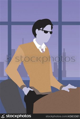 Businessman standing near a table