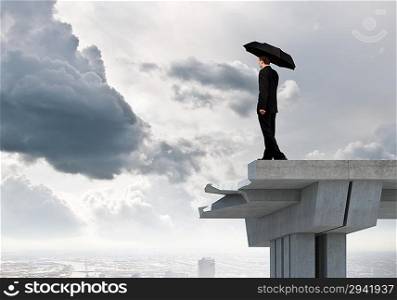 Businessman standing on bridge