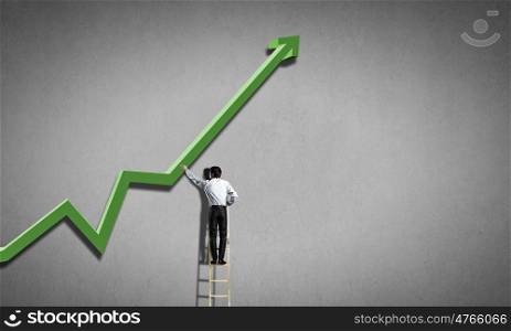 Businessman standing on ladder and reaching growing graph. Climb to success