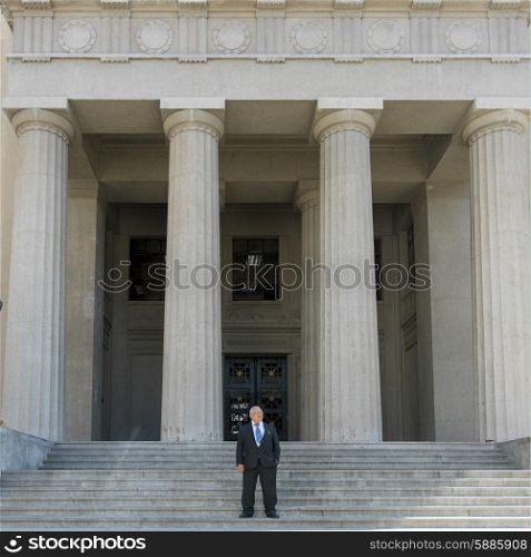 Businessman standing on stairs, Valparaiso, Chile