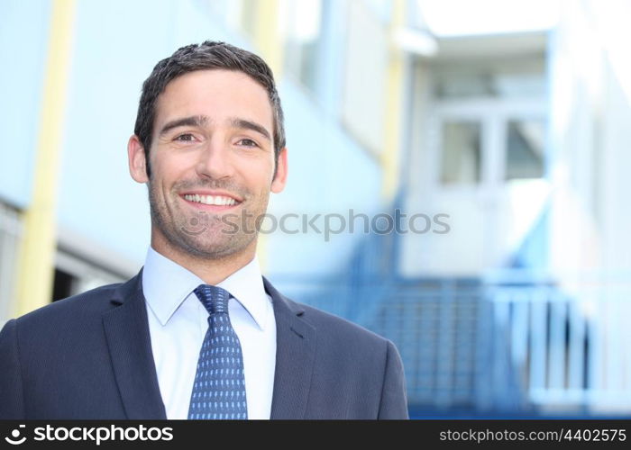 Businessman standing outside a building