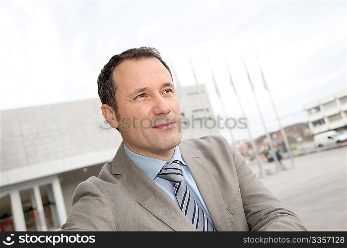 Businessman standing outside the office