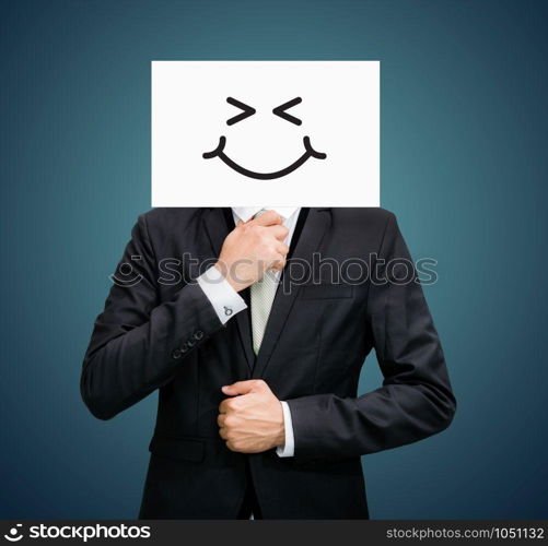 Businessman standing white paper happy smile face holding front of head on dark background