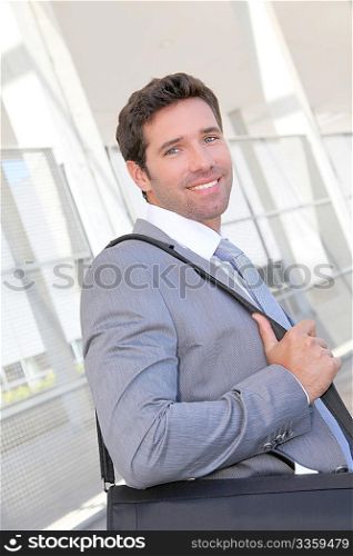 Businessman standing with briefcase