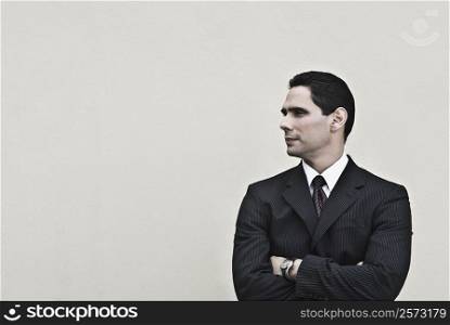 Businessman standing with his arms crossed
