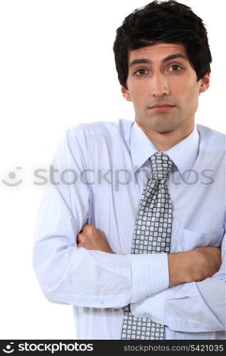 businessman standing with his arms crossed