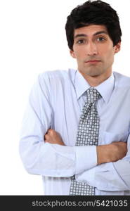 businessman standing with his arms crossed