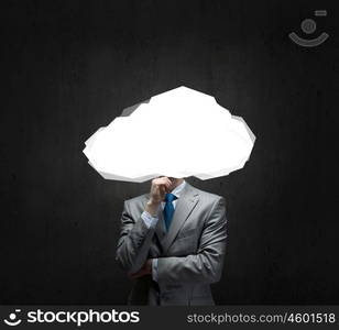 Businessman standing with his head in cloud. Floating in sky