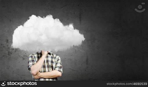 Businessman standing with his head in cloud. Floating in sky