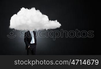 Businessman standing with his head in cloud. Floating in sky