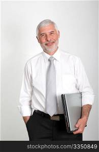 Businessman standing with laptop computer