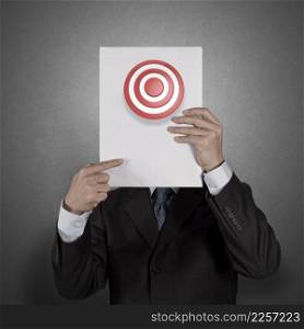 Businessman standing with on blank board with target sign as business concept