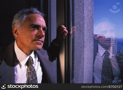 Businessman Staring out the Window