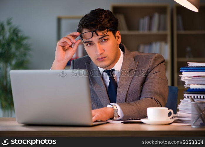 Businessman staying in the office for long hours