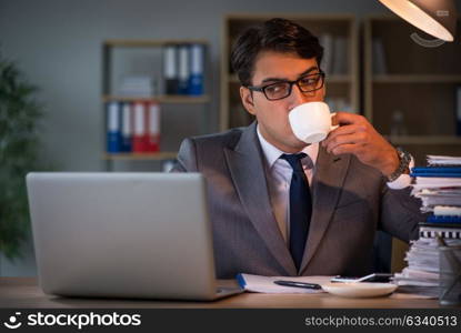 Businessman staying in the office for long hours