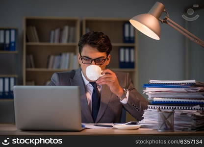 Businessman staying in the office for long hours