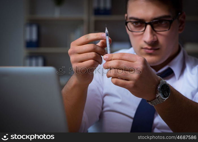 Businessman staying late in office for drugs