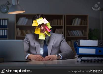 Businessman staying late to sort out priorities