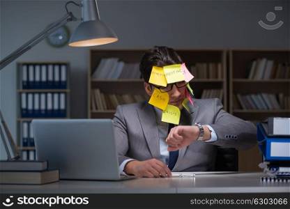 Businessman staying late to sort out priorities. The businessman staying late to sort out priorities