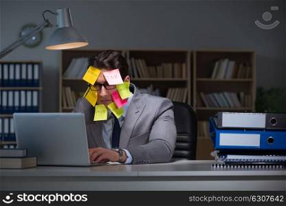 Businessman staying late to sort out priorities. The businessman staying late to sort out priorities