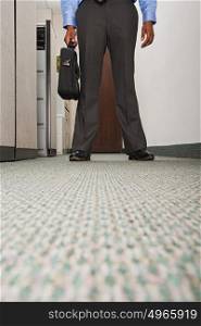 Businessman stood in corridor