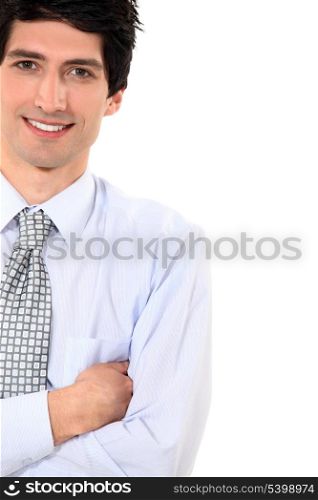 Businessman stood with arms folded