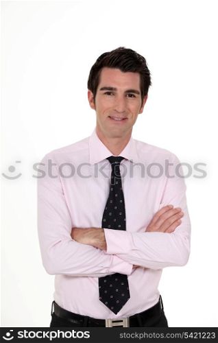 Businessman stood with arms folded