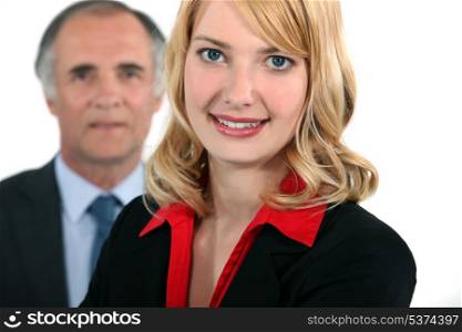 Businessman stood with assistant